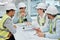 Sitting down to talk construction. Cropped shot of a group of young constructions having a meeting on their building