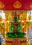 Sitting Emerald Buddha golden statue in thai Doi Suthep temple