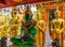 Sitting Emerald Buddha golden statue in the wat thai temple