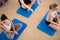 Sitting on exercise floor mat