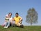 Sitting family with two children. spring.