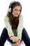 Sitting female listening track on headphone