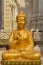 The sitting gold buddha statue