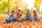 Sitting kids holding watermelon and eating