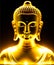 Sitting statue of smiling buddha with lighted candles. Golden buddha glowing holy colorful light.