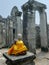 Sitting stone Buddha wrapped in golden cloth, Cambodia