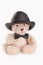Sitting teddy bear with bow tie and hat