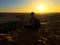 Sitting at the top of grand dune in Sahara Desert