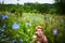 Sitting in wildflowers field