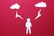 Situation of origami paper clouds and lightning strikes man on red background. white man in paper stands under storm cloud
