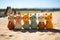 Six Cheerful crocheted little multicolored kittens in beach sand with meadow and sea in the background, Colorful