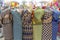 Six colorful African fabrics presented as dresses on mannequins in Mozambique