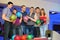 Six friends stand and holds balls for bowling