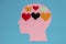 six hearts in a pink paper head instead of a brain, creative love design, sensitive flat composition