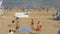 Six males playing volleyball on the beach