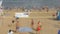 Six males playing volleyball on the beach