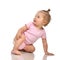 Six month infant child baby toddler sitting in pink body and diaper