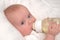 Six month old baby boy drinking bottle