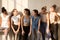 Six multi-ethnic girls enjoying conversation after workout