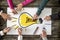 Six people, men and women, drawing bright yellow light bulb