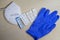 Six positive corona rapid tests lie next to a medical face mask and a blue medical glove