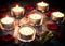 Six Romantic Tea Lights On Slate With Rose Petals And Leafs