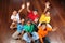 Six school children sitting in classroom hands up