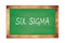 SIX  SIGMA text written on green school board