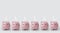 Six sleepy pink piggy banks with eyes closed on white background