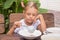 Six year old girl puts his plate buckwheat