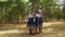 Six young women in Russian Traditional Folk Costumes are dancing in summer forest