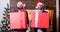 Size matters. Men santa carry big gift boxes. Biggest gift for christmas. Big wrapped box with ribbon. Great surprise