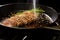 sizzle shot of tuna steak frying, sesame seeds popping