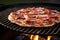 sizzling bbq pizza with pepperoni on charcoal grill