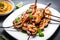 Sizzling plate of grilled shrimp skewers with a tangy garlic and lemon marinade
