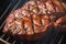 Sizzling sensation Close up beef flank steak grilling to savory perfection