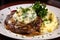 sizzling steak, paired with creamy mashed potatoes and plenty of fresh herbs