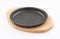 Sizzling wood metal plate Clean and empty on white background