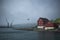 SkansapakkhusiÃ° at the tip of Tinganes peninsula and Torshavn Port cranes over the Eystara VÃ¡g.