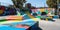 A skate park adorned with vibrant murals, fusing urban sports and street art in a dynamic public space, concept of