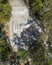 Skate park view fron the sky taken from a drone in the middle of a park with trees