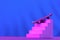 Skate in pink on the stairs, as a symbol of extreme sports, skateboarding, parkour, roller skates on a blue background