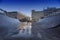 Skate ramp field with beautiful architecture and dark blue sky background.