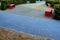 Skateboard, skating park for roller skating with a concrete cement surface painted blue and yellow. turns and training waves with