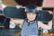 Skateboarder boy in helmet posing in skate park. Kid boy with skateboard. Childhood, leasure, lifestyle concept. Portrait stylish