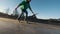 Skateboarder does tricks jumping on the ramp outdoors