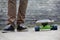 Skateboarder feet and skateboard in urban setting