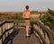 Skateboarder on Fire Island Lighthouse boardwalk