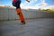 Skateboarder legs jumping an ollie