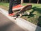 Skateboarder make back slide trick on park